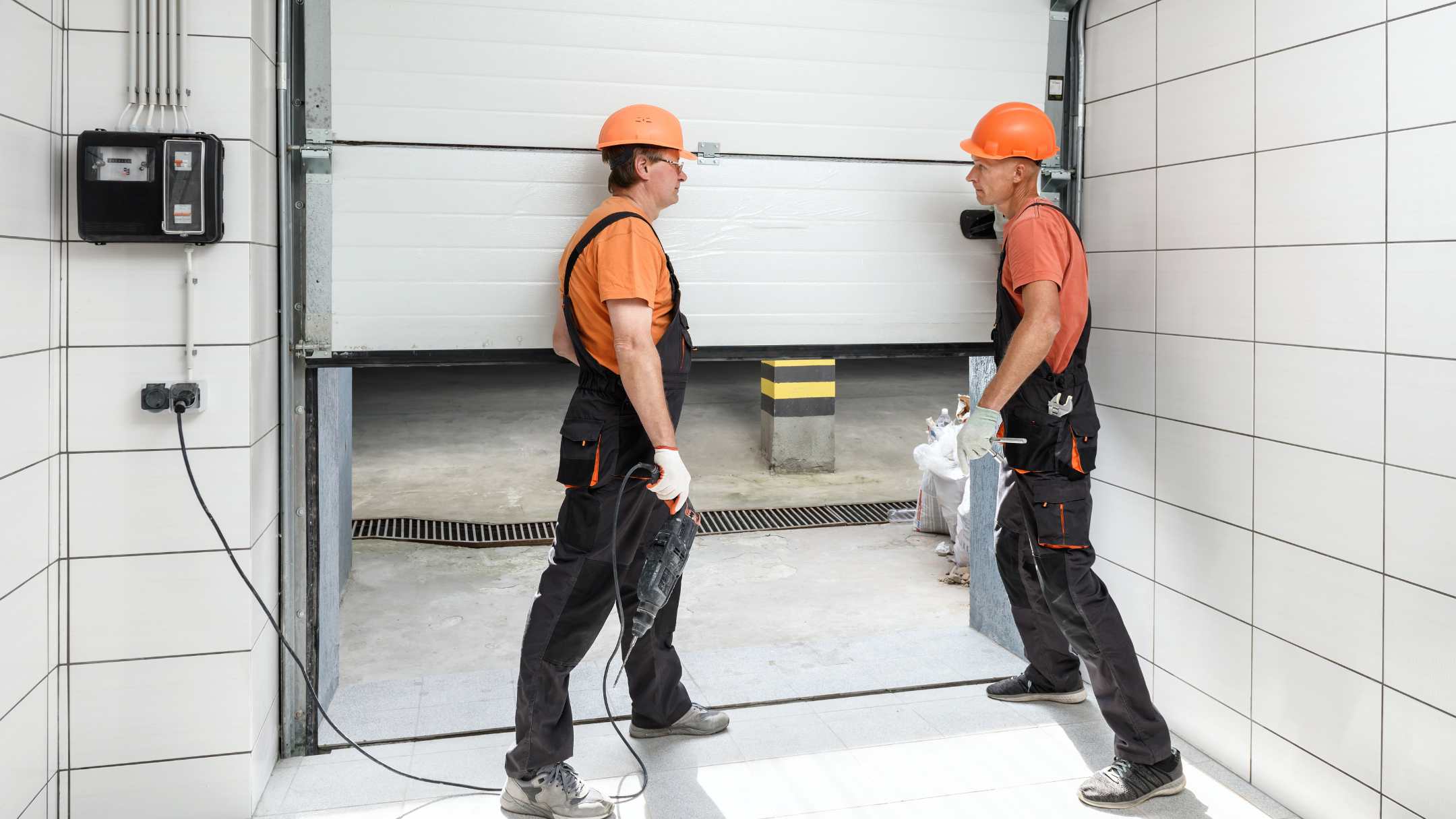 Workers are installing lift gates in the garage